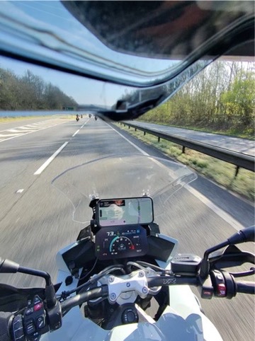Motorcyclist's view from a GoPro chin-mount showing a group of riders ahead on a UK motorway